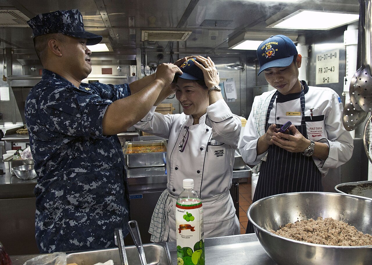 Thai chefsconduct a cooking exchange with U.S. Navy chefs
